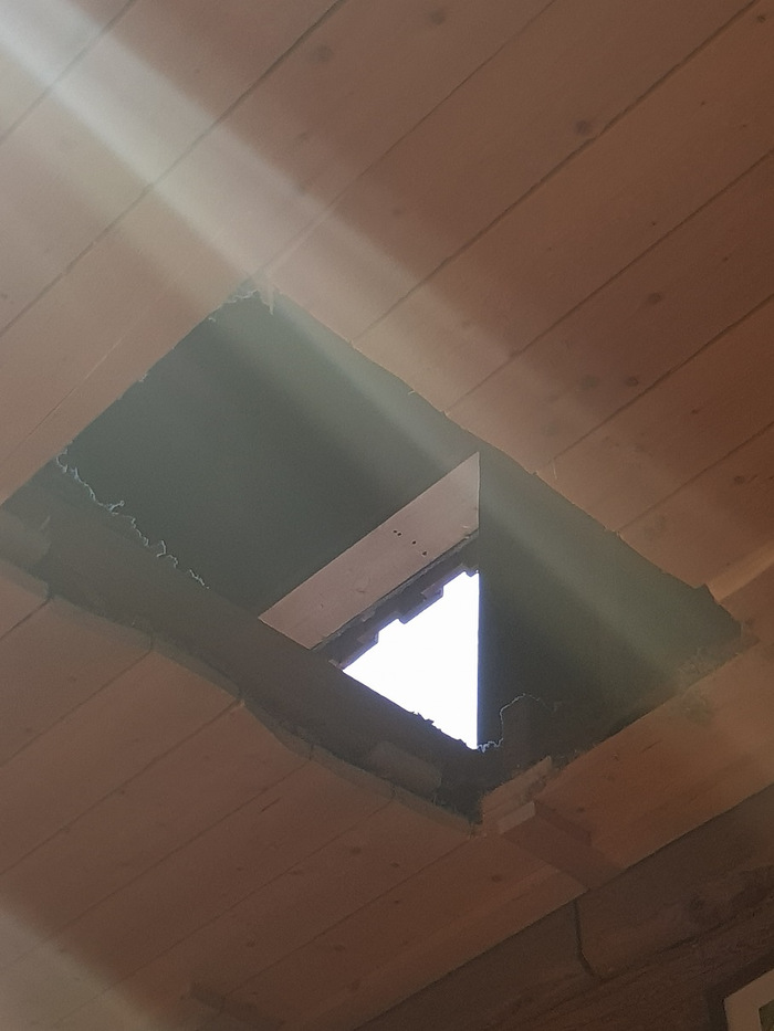 Hole in the ceiling made by burglars